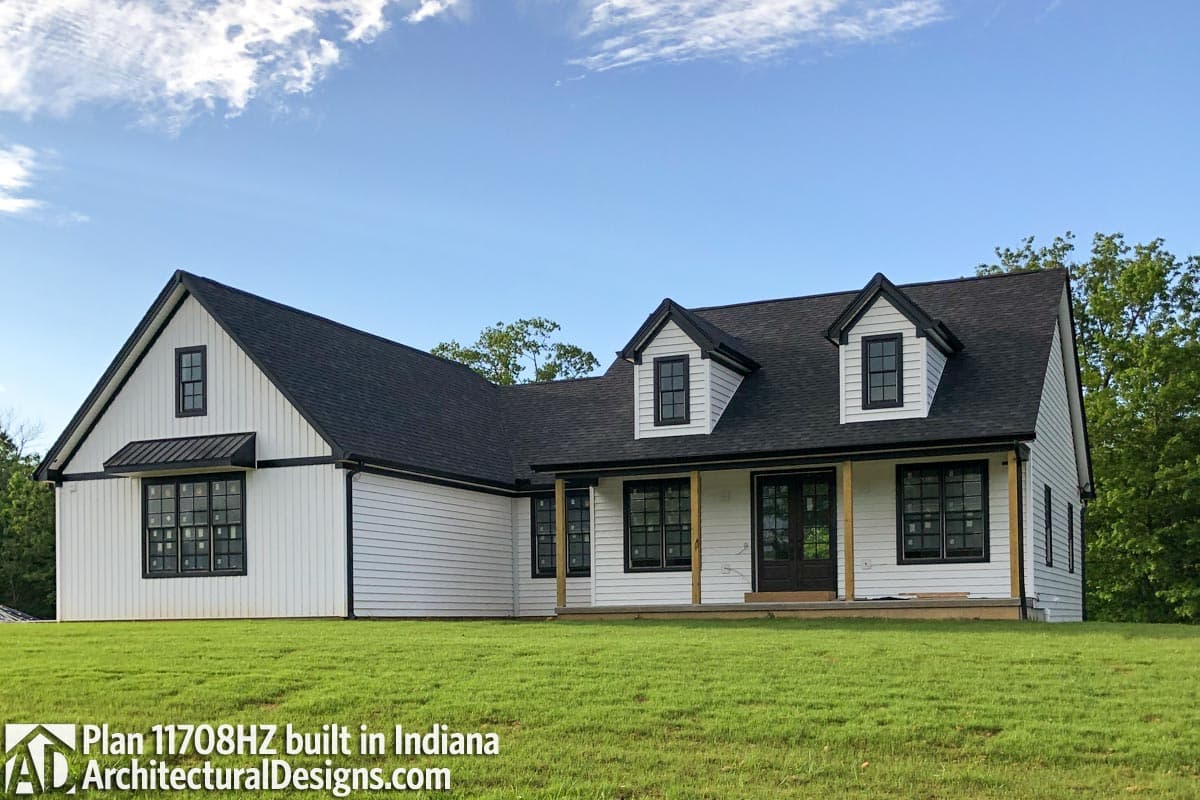 Modern Farmhouse house plan exterior with white siding, black trim, and two dormers.