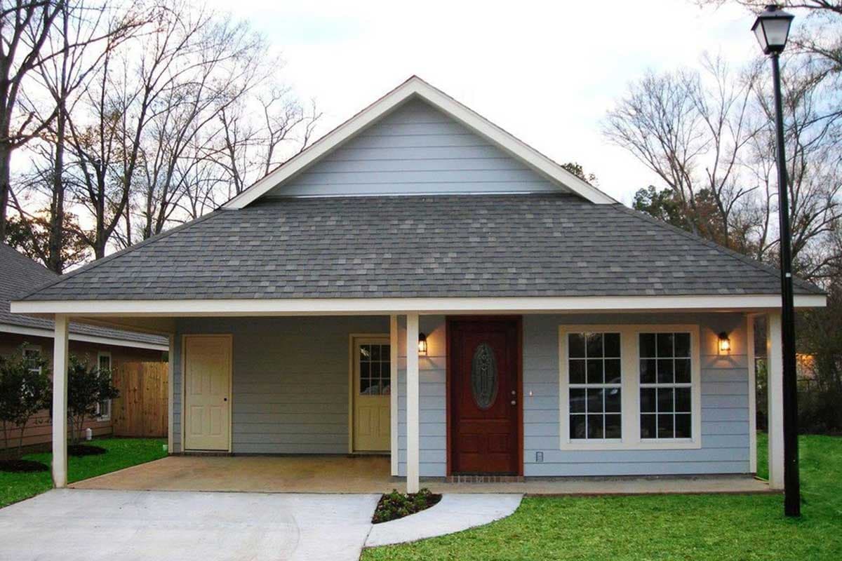 House plan exterior: Single-story home with a covered carport, gable front, and asphalt shingle roof.