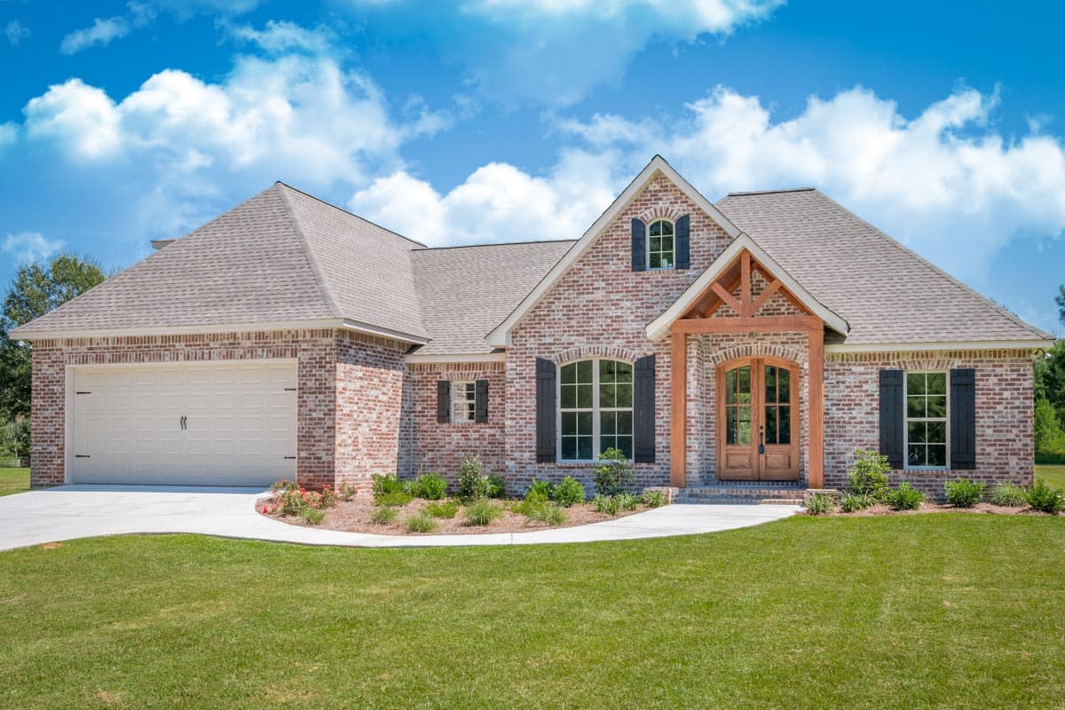 House plan exterior: brick, one-story, gabled roof, attached garage, covered entry with wooden beams.