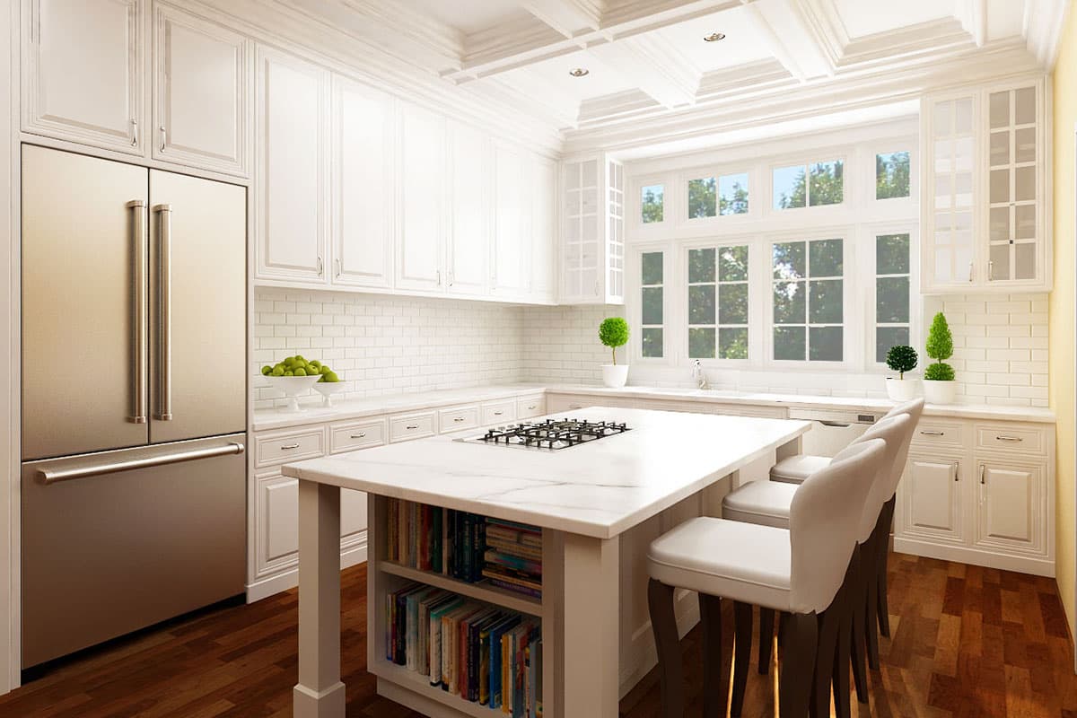 Kitchen with white cabinetry, subway tile backsplash, marble island with cooktop, and large multi-pane window.