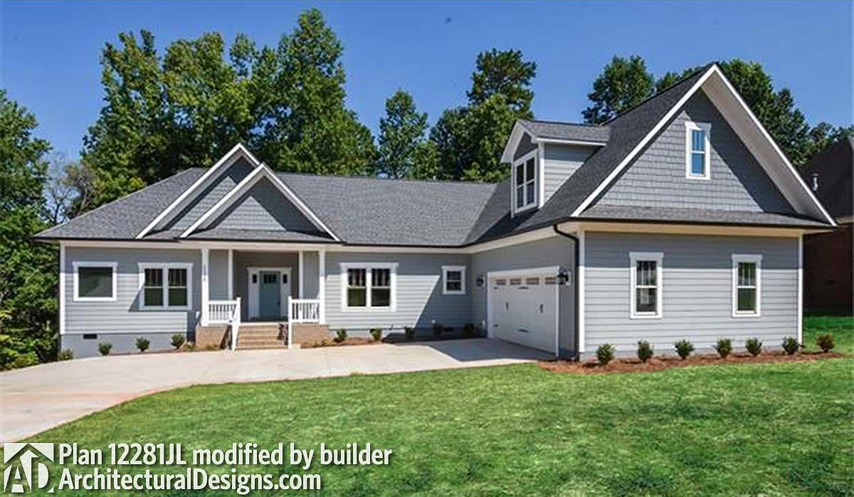 House plan exterior: Ranch style, one-story with gabled roof, dormer, covered front porch, and side-entry garage.