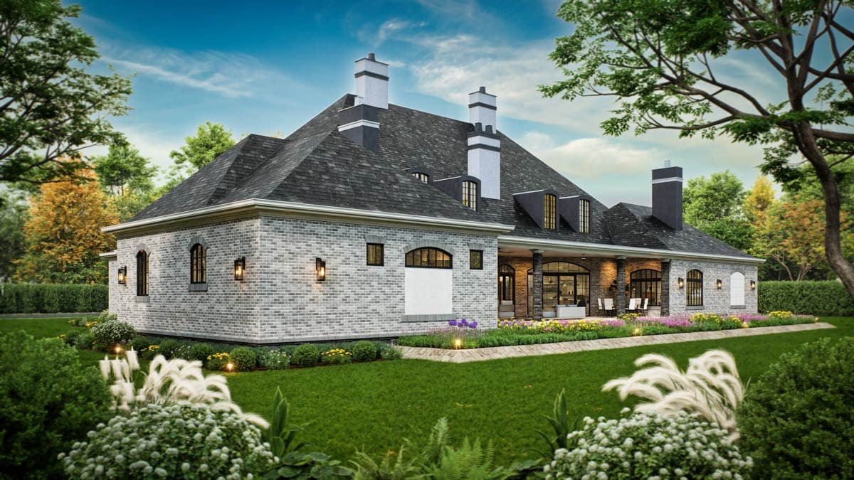 House plan exterior with grey brick, multiple gables, dormers, covered porch, and chimneys.