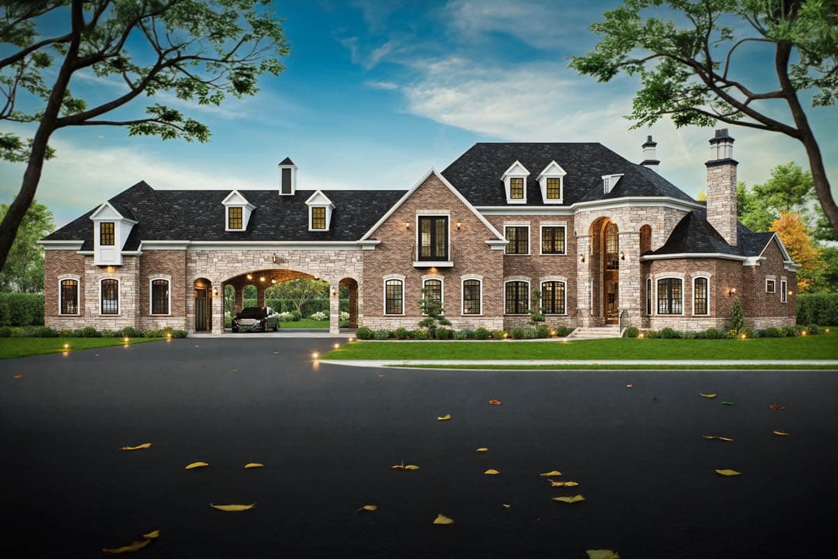 House plan exterior. Two-story brick and stone facade with dormers, arched entry, multiple gables, and a porte-cochère.