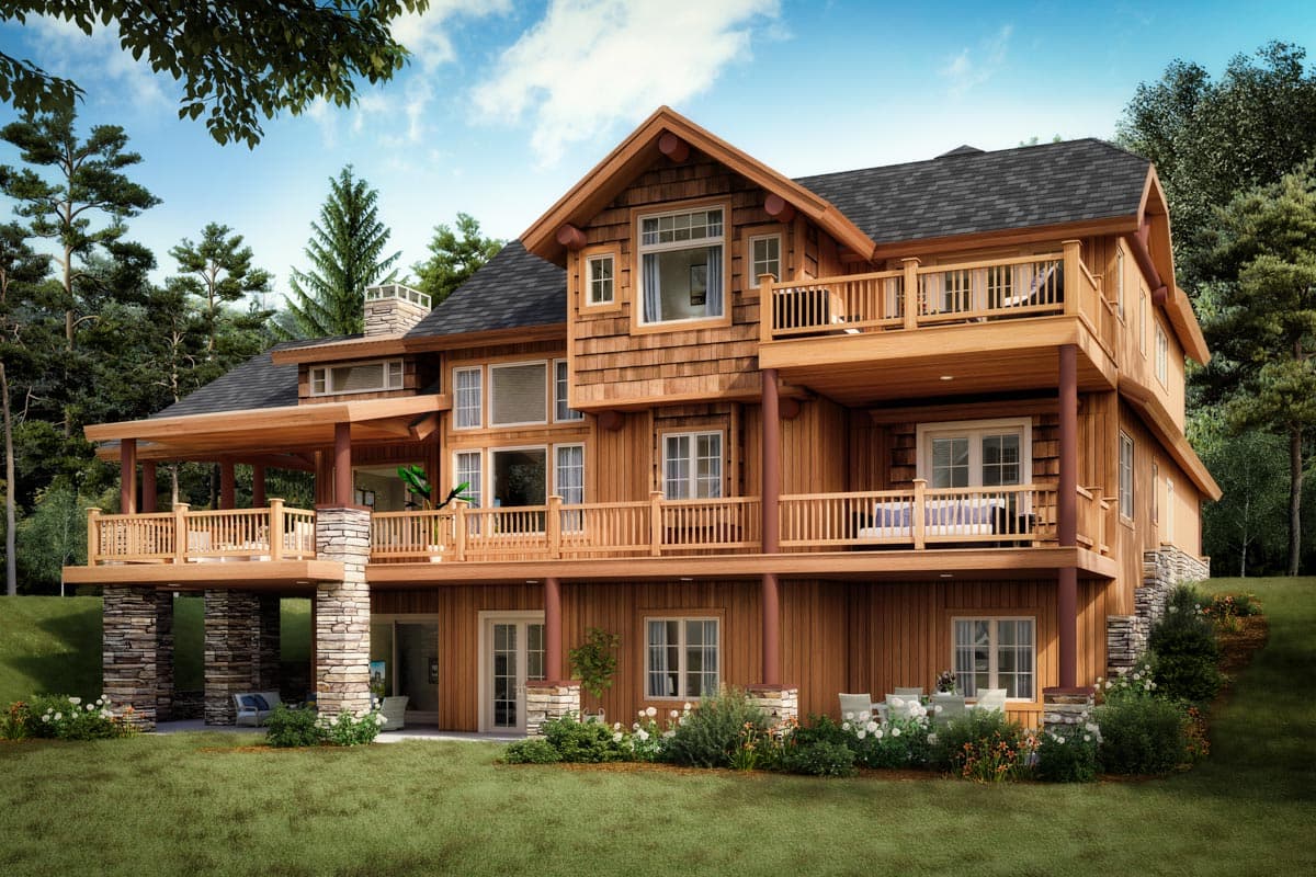 House plan exterior showing a three-story wood-clad home with multiple decks, stone-covered supports, and prominent gables.