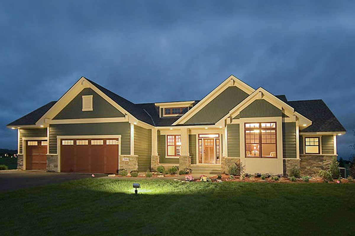 House plan exterior. Craftsman style with two stories, gabled rooflines, a front porch, and an attached garage.