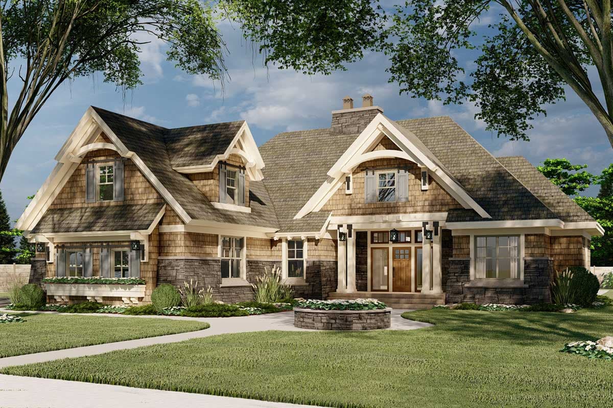 Craftsman house plan exterior with multiple gables, dormers, stone and shake siding, and a covered front entry.