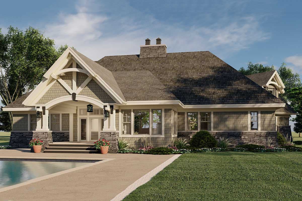 House plan exterior: Ranch style with prominent gables, stone accents, covered entry porch, and multiple chimneys.