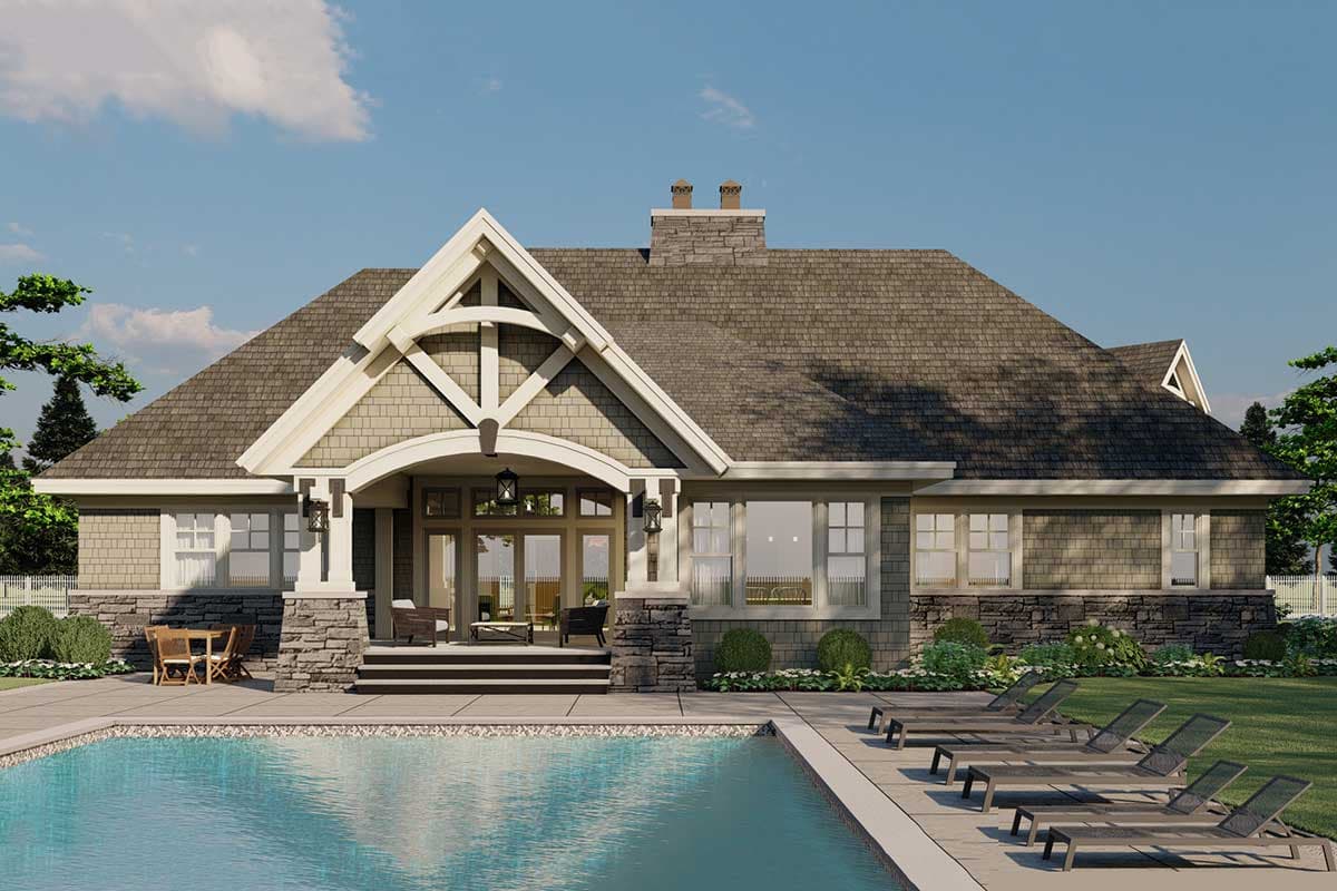 Craftsman style house plan exterior with prominent gable, stone accents, covered entry, and expansive pool area.