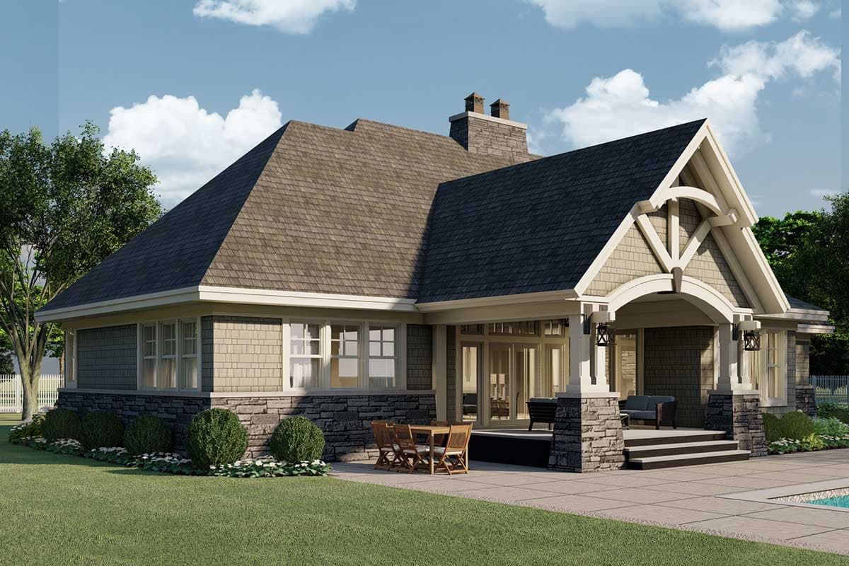 House plan exterior: Ranch style with stone base, shingle siding, prominent gabled portico, and large chimney.
