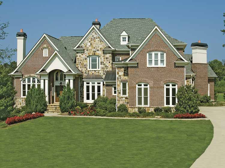 House plan exterior: Two-story home with brick and stone facade, prominent gables, arched entry, and multiple dormers.