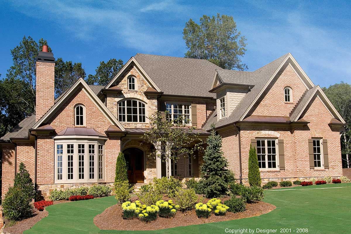 House plan exterior showing a two-story brick home with gables, dormers, arched windows, and a bay window.