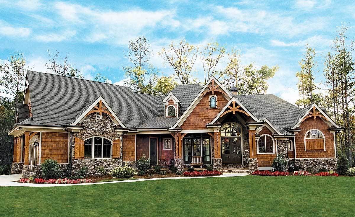 House plan exterior: Craftsman style with stone and wood siding, multiple gables, dormers, and arched windows.