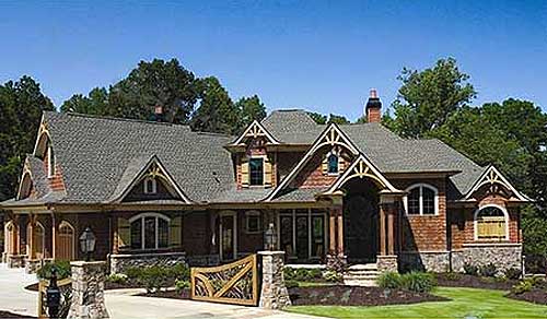 Craftsman style house plan exterior with multiple gables, arched entryway, stone accents, and decorative wooden gate.