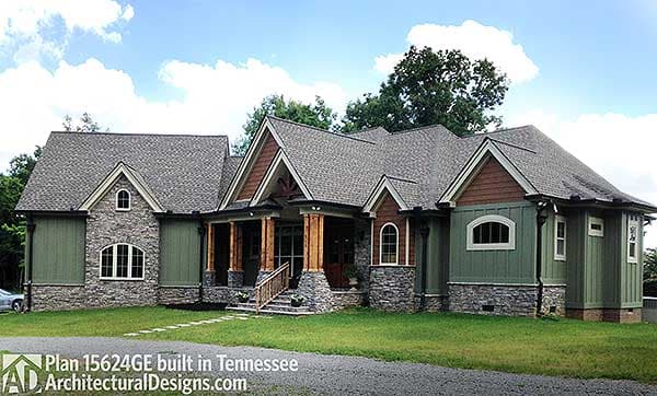 House plan exterior: Modern Farmhouse style, one-story, with stone and board-and-batten siding, gables, and covered porch.