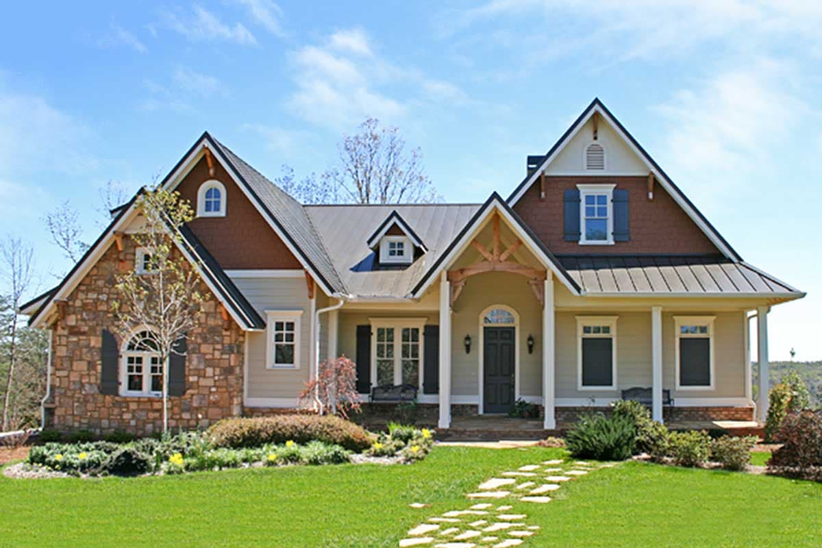 Craftsman style house plan exterior with stone accents, prominent gables, and a covered front porch.