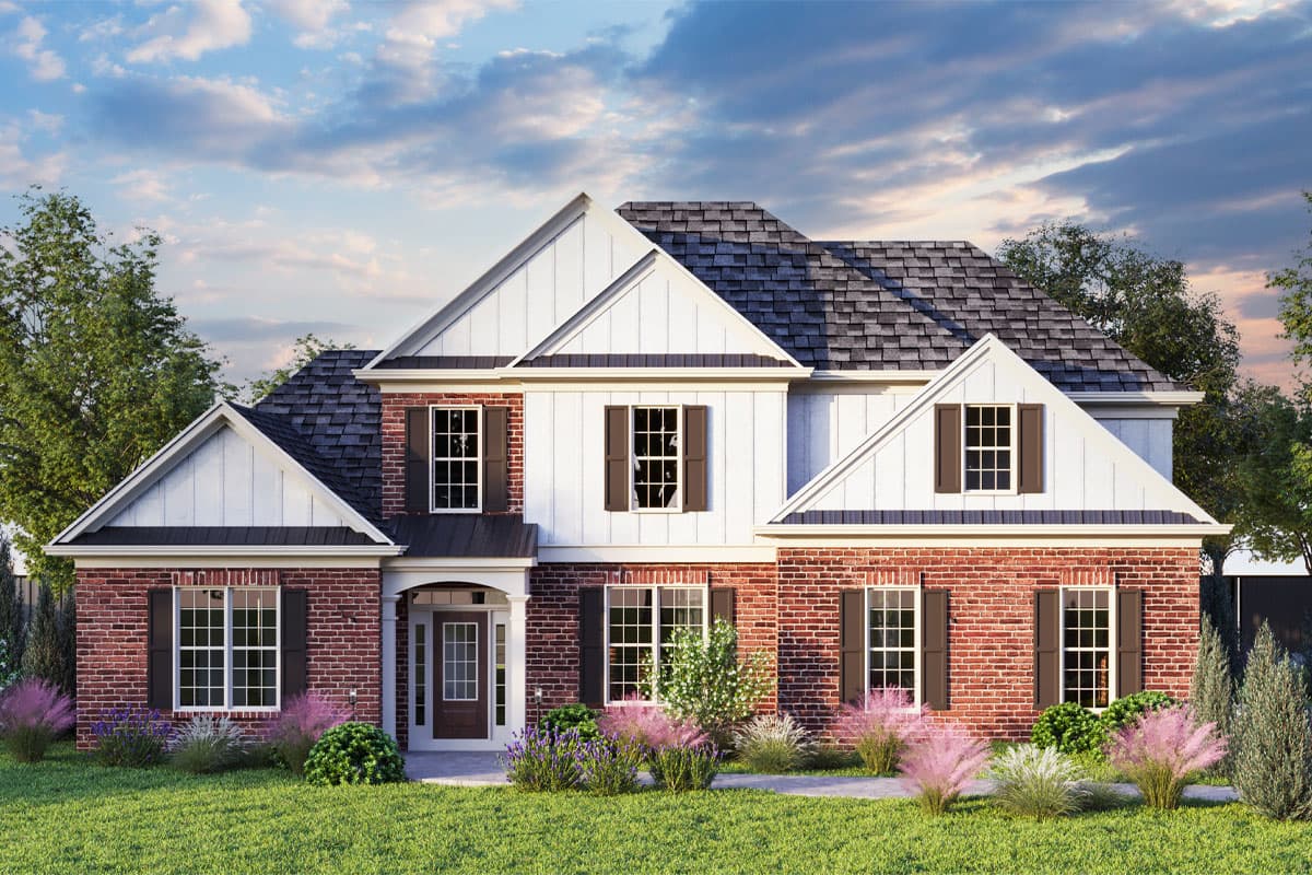 House plan exterior. Two-story home with a brick and shingle facade. Features include a front porch, gabled roof, and multiple dormers.