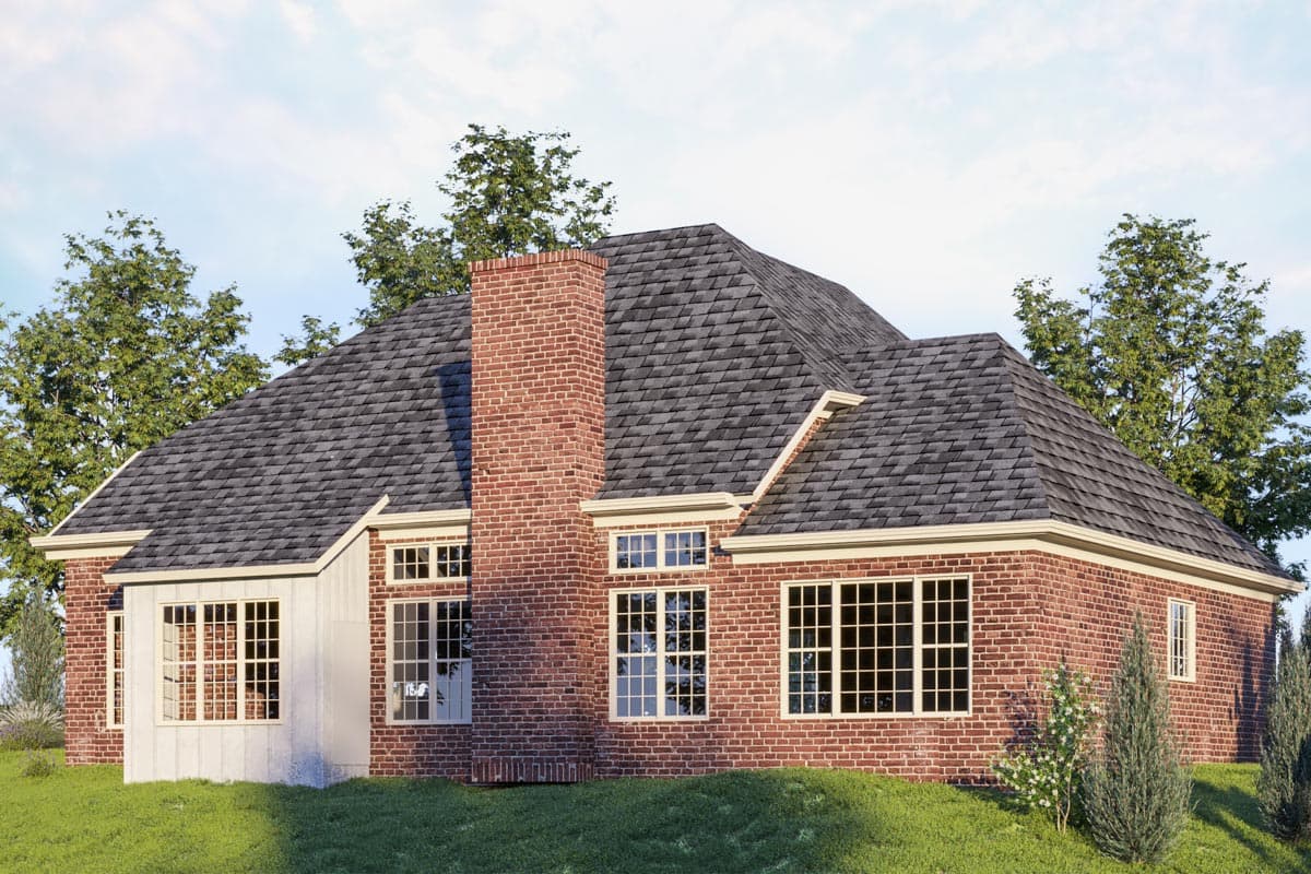 House plan exterior with brick facade, gambrel roof, large multi-pane windows, and prominent chimney.