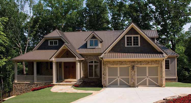 House plan exterior: Craftsman style, two stories, metal roof, stone accents, wrap-around porch, and a two-car garage.