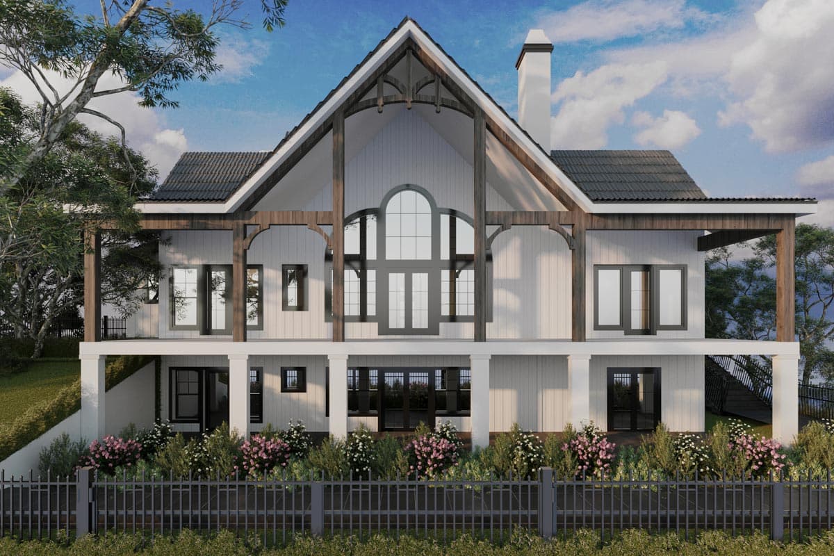 House plan exterior: Modern design with exposed timber beams, a prominent gable roof, large arched window, and covered porch areas.
