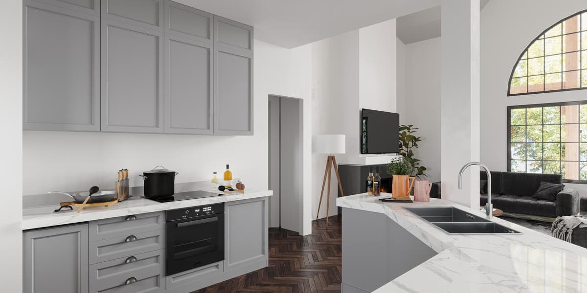 Modern kitchen with gray cabinetry, marble countertops, and island with sink, opening to living area with fireplace and large arched window.