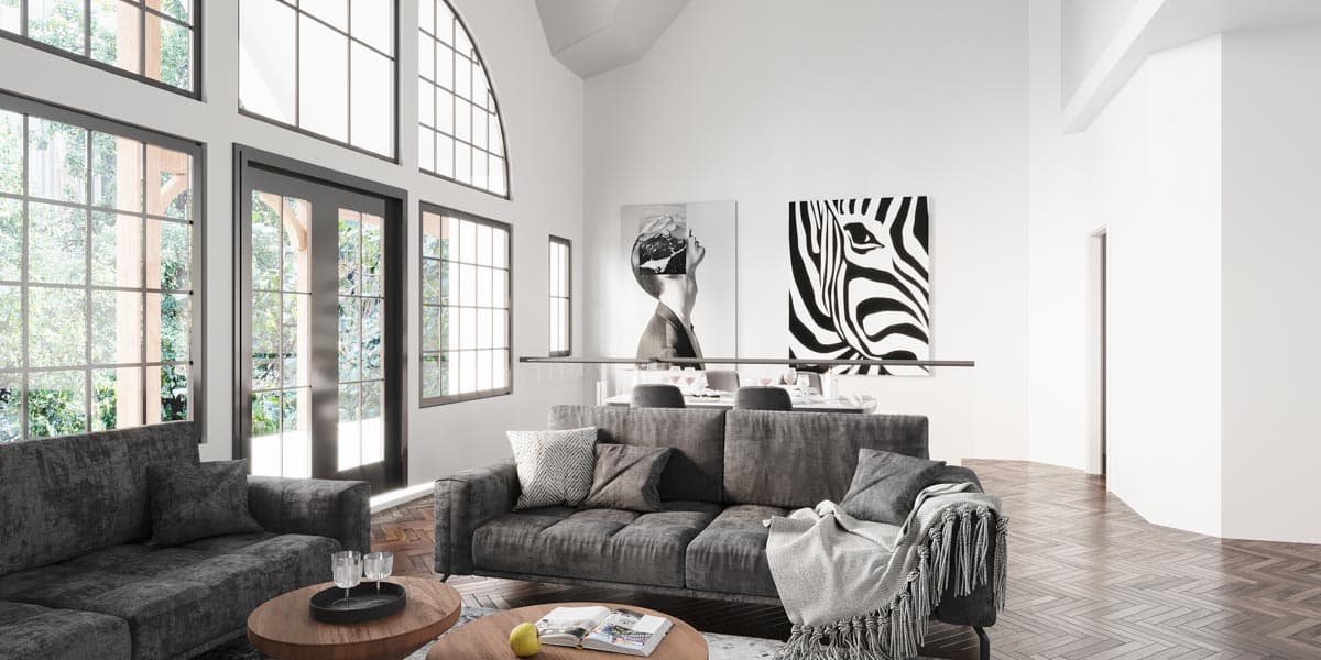 Interior rendering of a living room with vaulted ceiling, large gridded windows, and modern art.