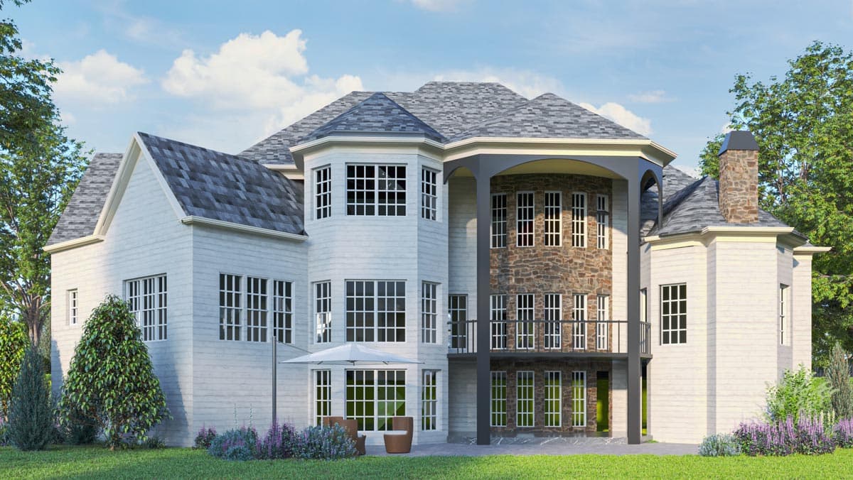House plan exterior features stone accents, multiple gables, bay windows, and a covered balcony with dark columns.