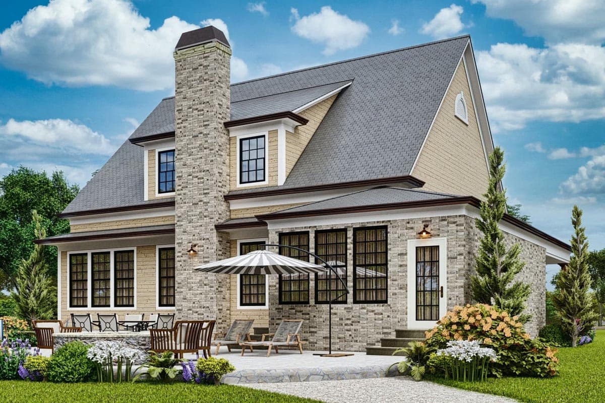 House plan exterior: Two-story home with stone accents, prominent chimney, gable roof, and covered patio with seating.