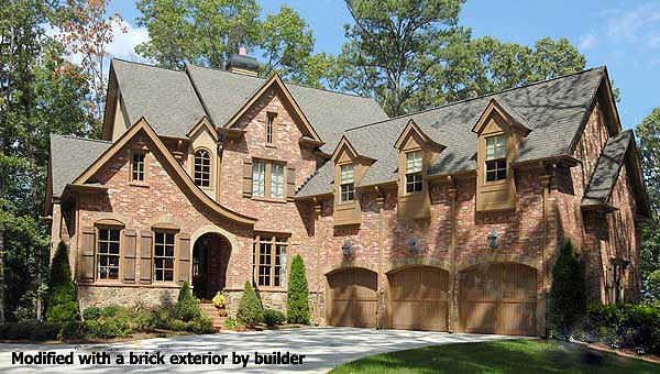 House plan exterior: Two-story brick home with arched entry, multiple gables, dormer windows, and three-car garage.