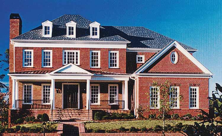 House plan exterior: brick, two-story, prominent central portico with columns, multiple gables, dormers, and a brick chimney.