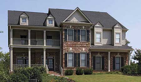 Two-story house plan exterior with brick facade, double-tiered covered porch, gables, and dormers.