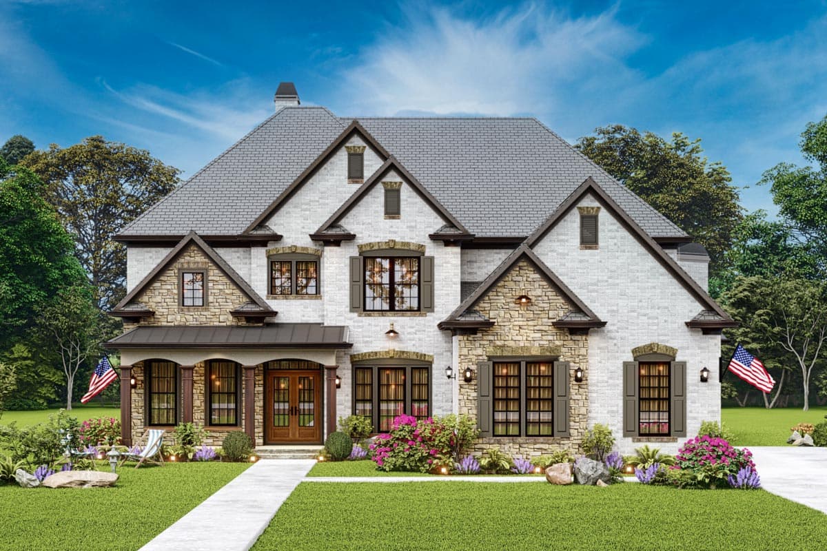 House plan exterior with two stories and a stone and brick facade. Features include a front porch, multiple gables, and a slate roof.