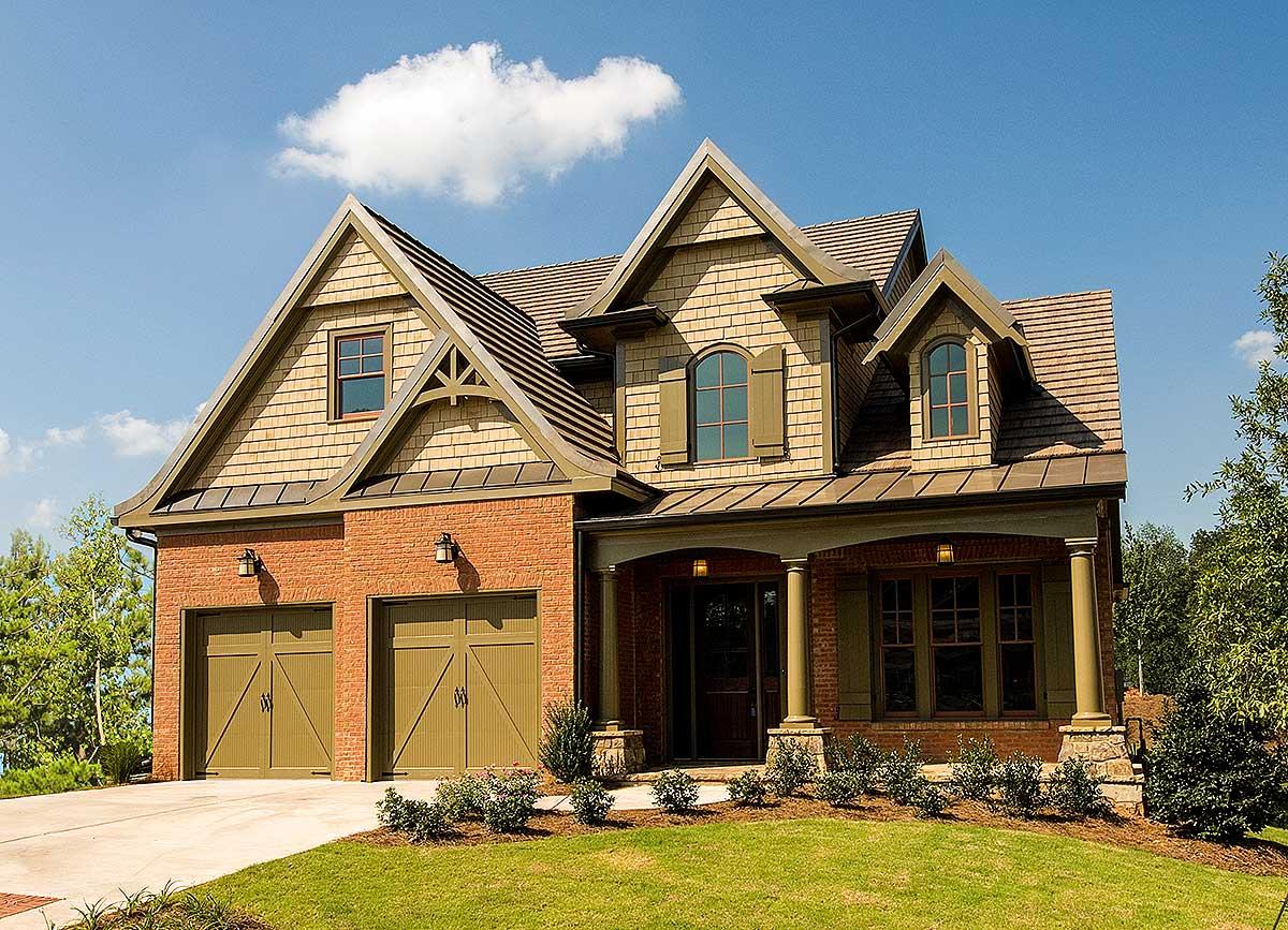 House plan exterior featuring Craftsman style, two stories, gabled roof, brick facade, and covered porch.