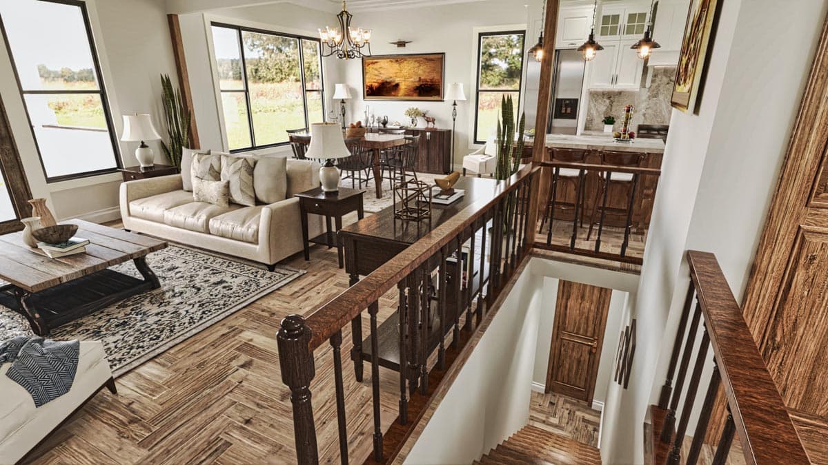 Open concept living and dining area with large windows, view to kitchen, and staircase.