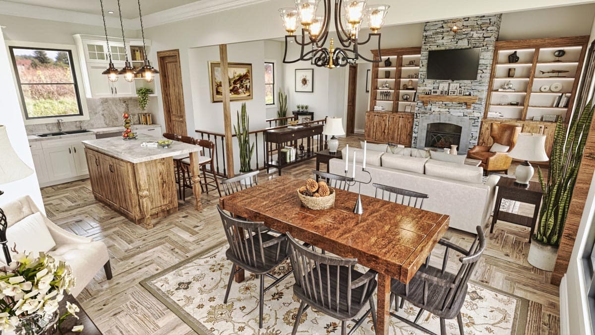 Open-concept living space with kitchen island, dining table, and living room featuring stone fireplace and built-in shelving.