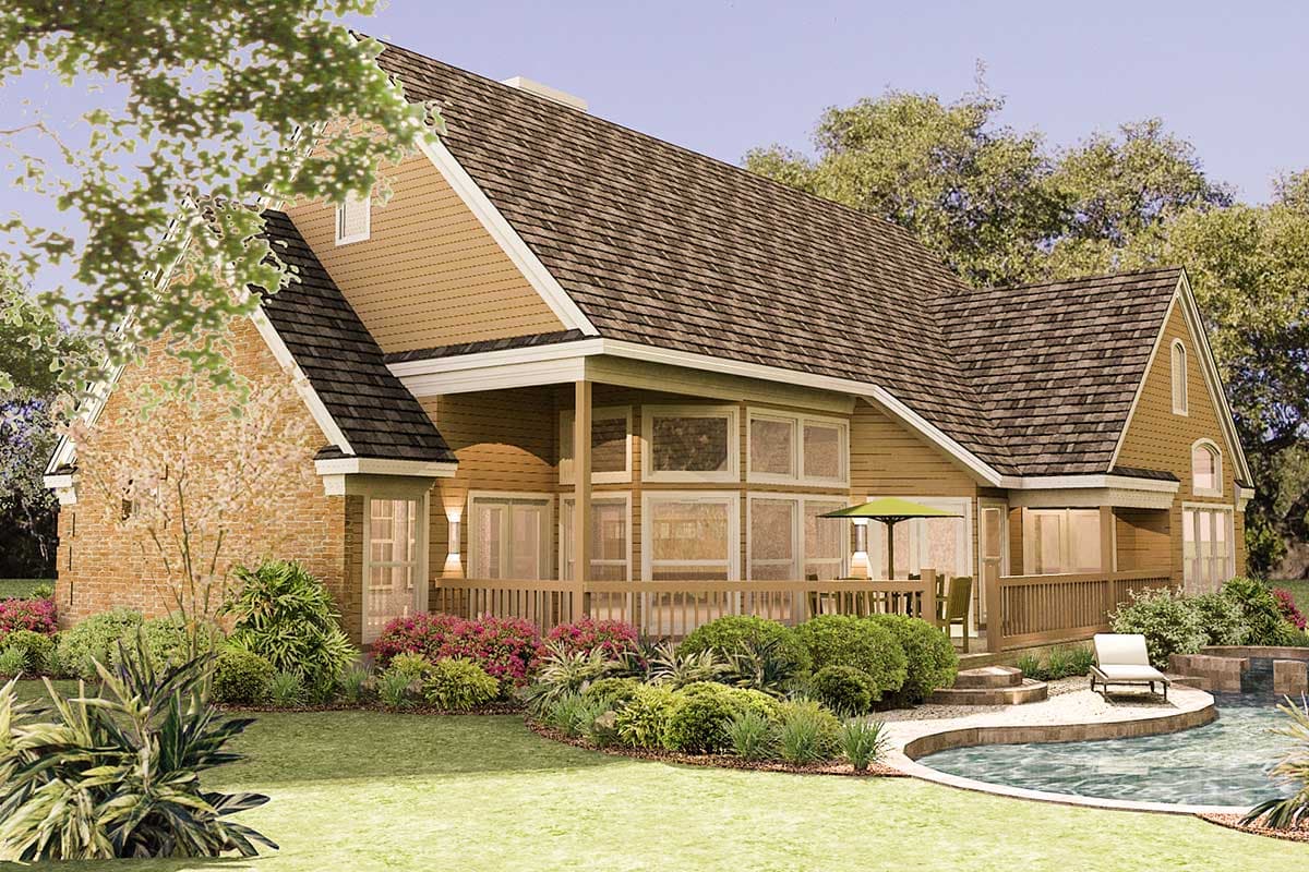 House plan exterior: Two-story home with stone accents, gabled dormers, covered porch, large windows, and a wrap-around deck.