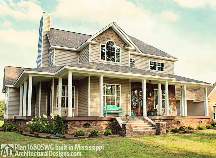 House plan exterior: Two-story Modern Farmhouse with wraparound porch, stone foundation, gables, and arched upper window.
