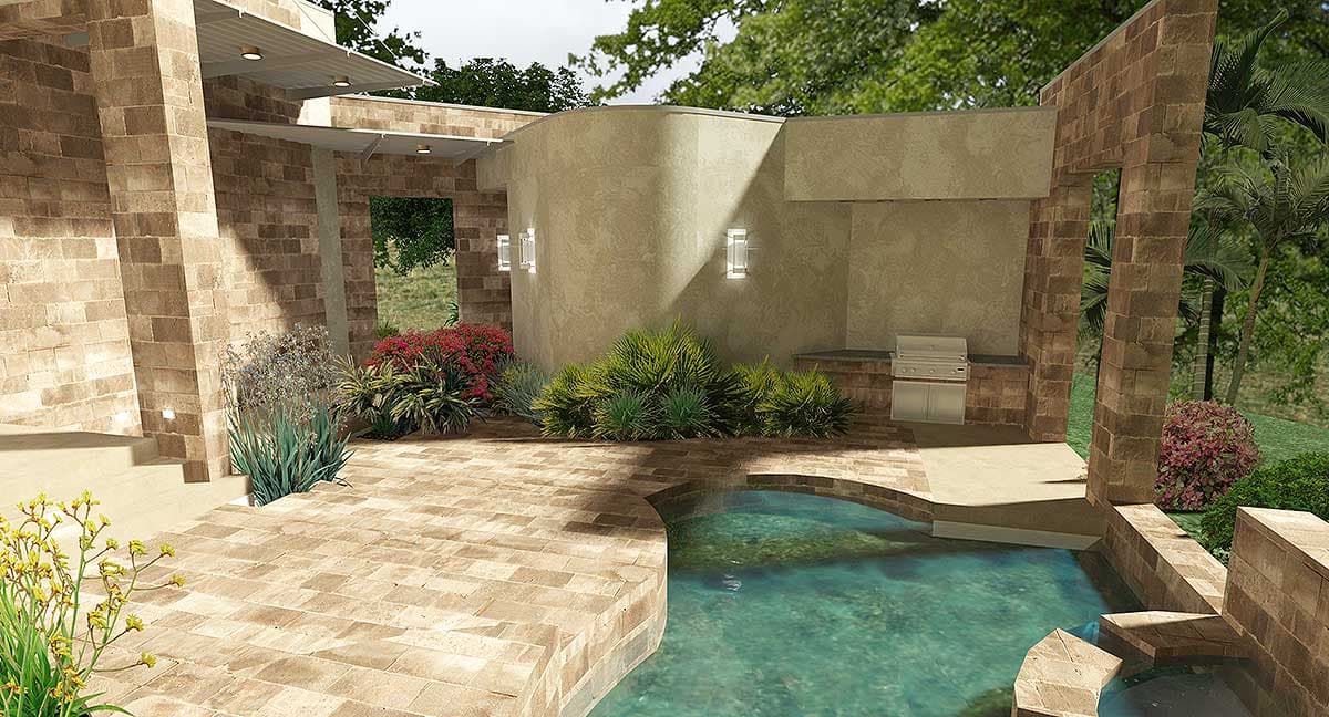 Outdoor living space with stone patio, pool, built-in grill, and stucco walls.