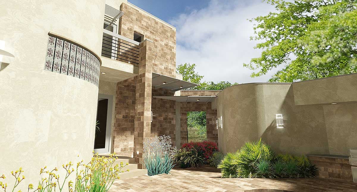 House plan exterior with curved wall, glass block window, metal awnings, and stone accents.