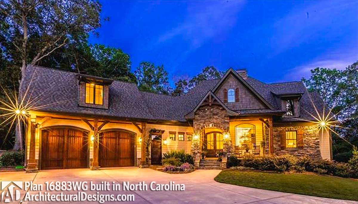 House plan exterior: Lodge style, two stories, triple garage, stone accents, prominent gables, and dormer.