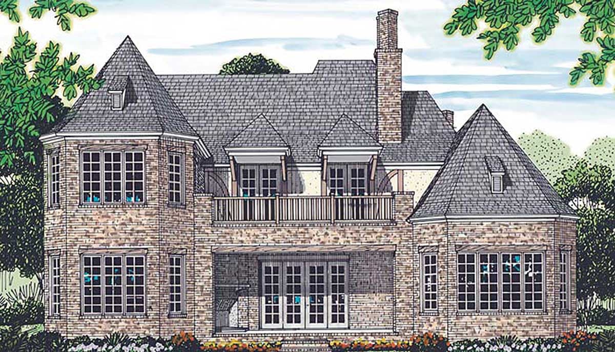 House plan exterior with turreted gables, multi-pane windows, central balcony, and porte-cochère.