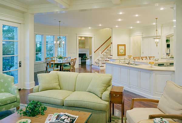 Open-concept living space with living area, dining nook, fireplace, and island kitchen.