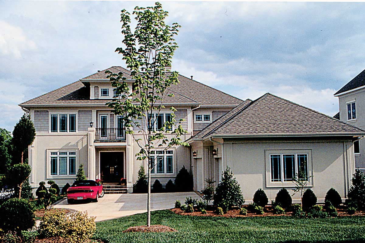House plan exterior for a two-story home with a covered entryway, multiple gables, and a stucco finish. Side-entry garage visible.