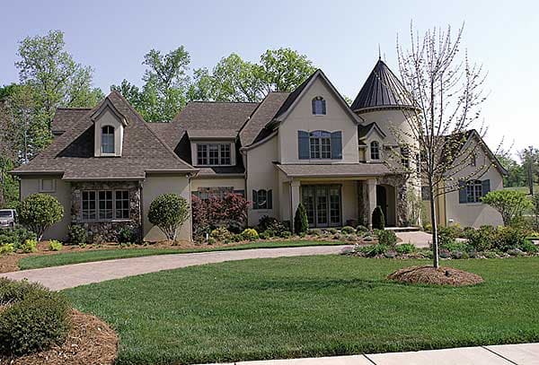 House plan exterior: French Country style, two stories, stone base, gabled dormers, arched windows, and turret.