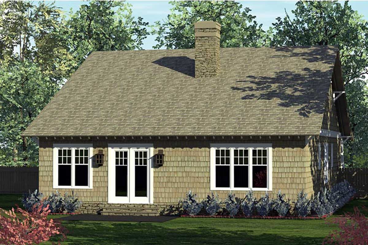 House plan exterior: Cottage style, 1.5 stories, with shingle siding, stone foundation, and prominent chimney.