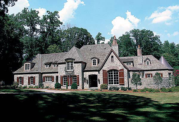 House plan exterior of a two-story stone home with multiple gables, arched windows, dormers, and a prominent chimney.