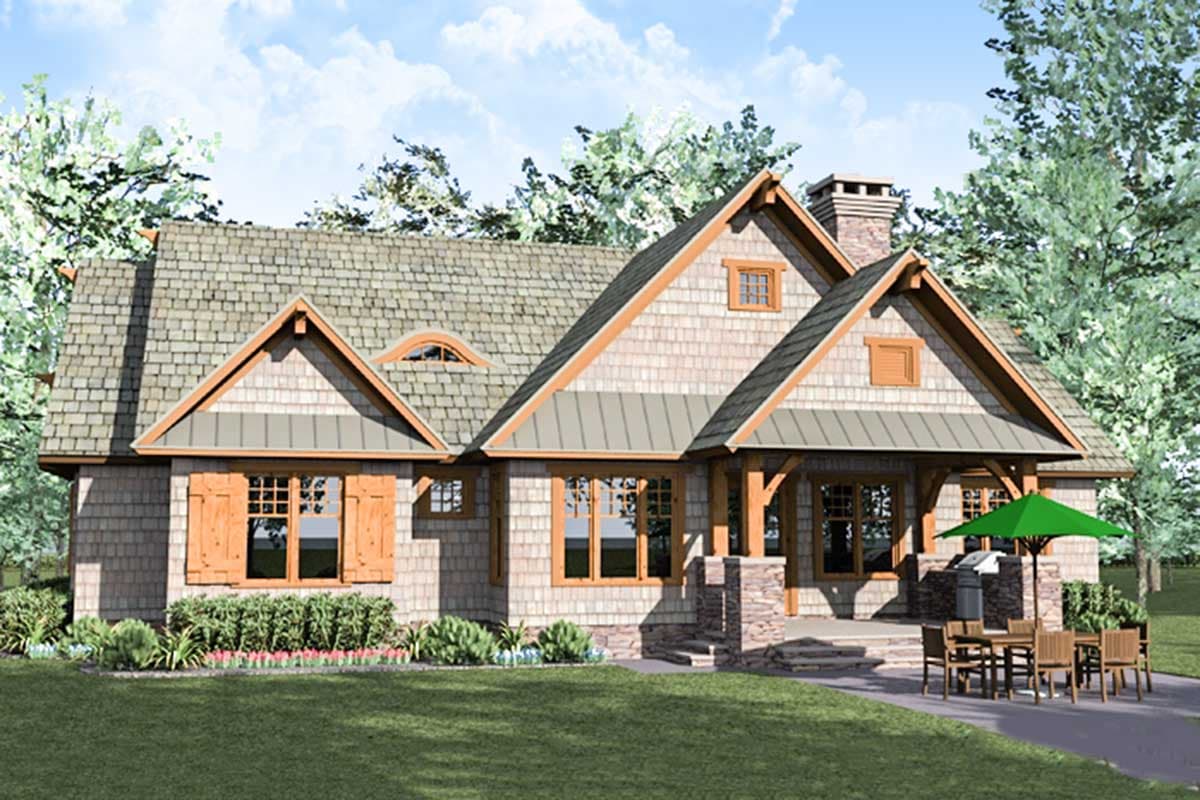 Craftsman house plan exterior with multiple gables, stone accents, dormers, and a covered porch.