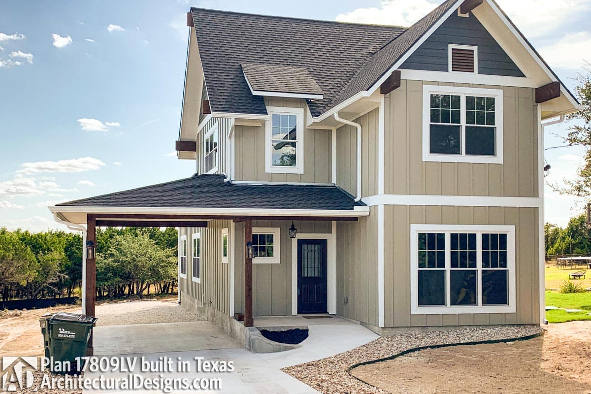 House plan exterior: Two-story Modern Farmhouse with covered carport, gables, dormers, and exposed rafter tails.