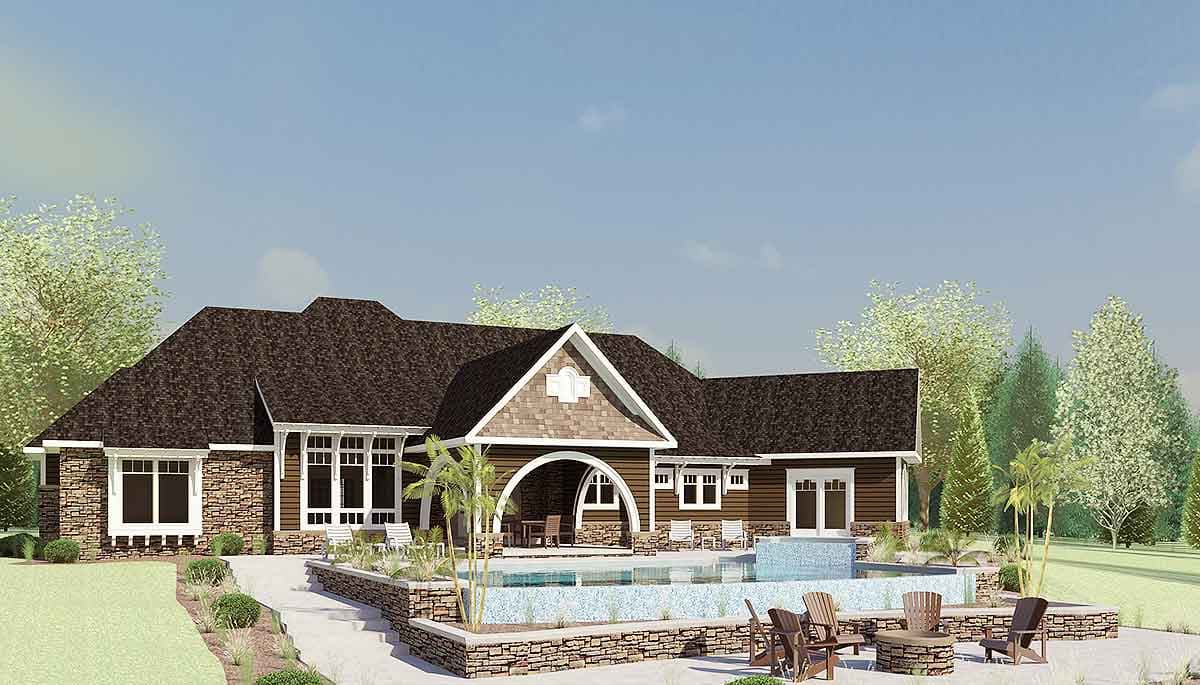 House plan exterior: One-story home with stone accents, multiple gables, covered arched entryway, and an infinity pool.