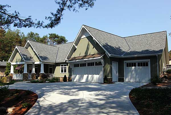 House plan exterior: Modern home with a covered front porch, gables, and a three-car garage.