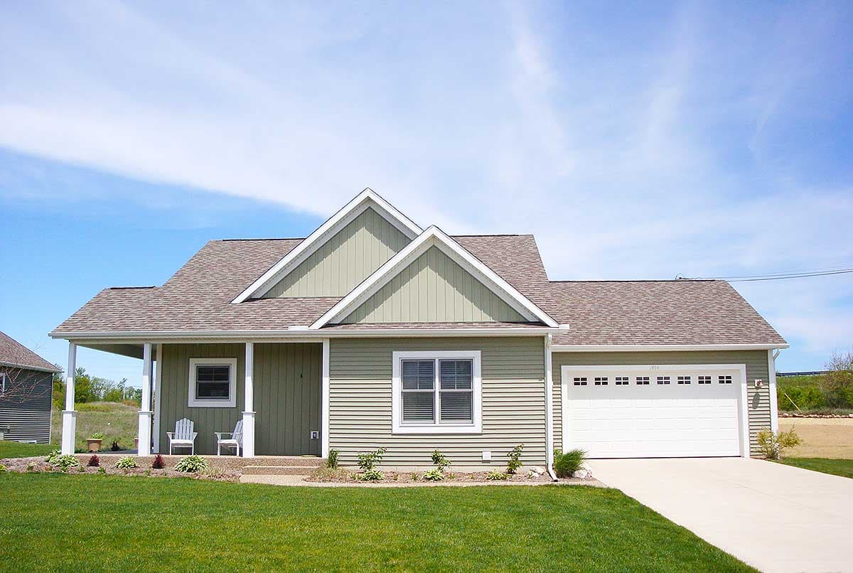 One-story house plan exterior with a covered porch, prominent gables, and a two-car front-facing garage.